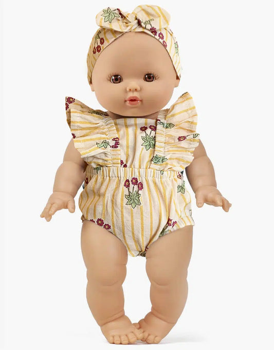 Faustine and her retro Lou Pâquerettes romper with headband
