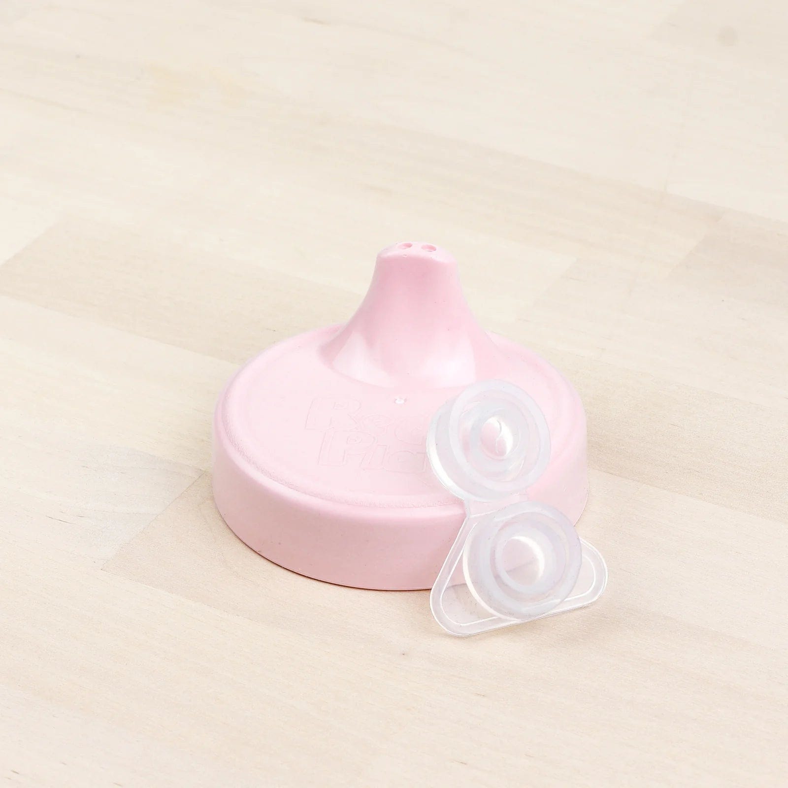 https://www.liltulips.com/cdn/shop/files/no-spill-sippy-cup-lid-valve-ice-pink-replay-lil-tulips-30861811187830.webp?v=1693068060&width=1600